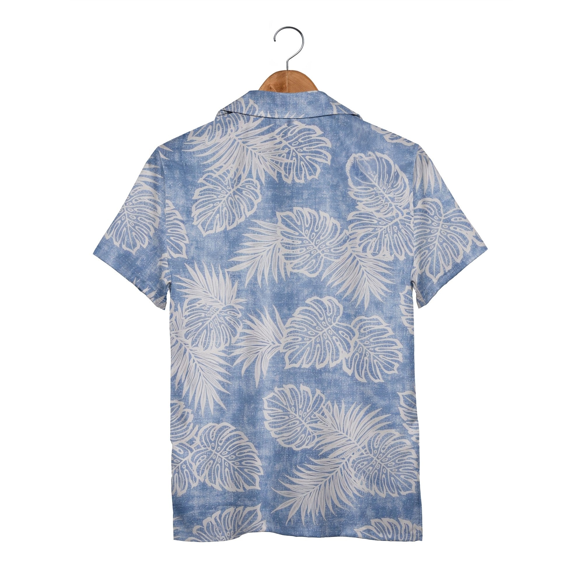 Textured blue Hawaiian shirt with monstera leaves and palm fronds in white outline art