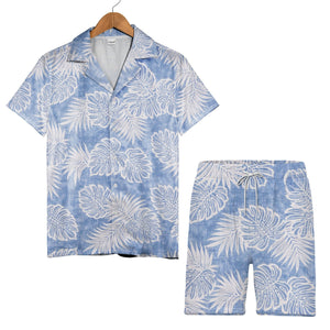 Textured blue Hawaiian shirt with monstera leaves and palm fronds in white outline art