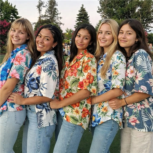 Group wearing custom floral Hawaiian shirts for team events, tropical outfits for friends and summer gatherings